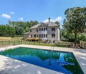 Home overlooks built-in pool in back yard of Custom East Cobb home built by Waterford Homes